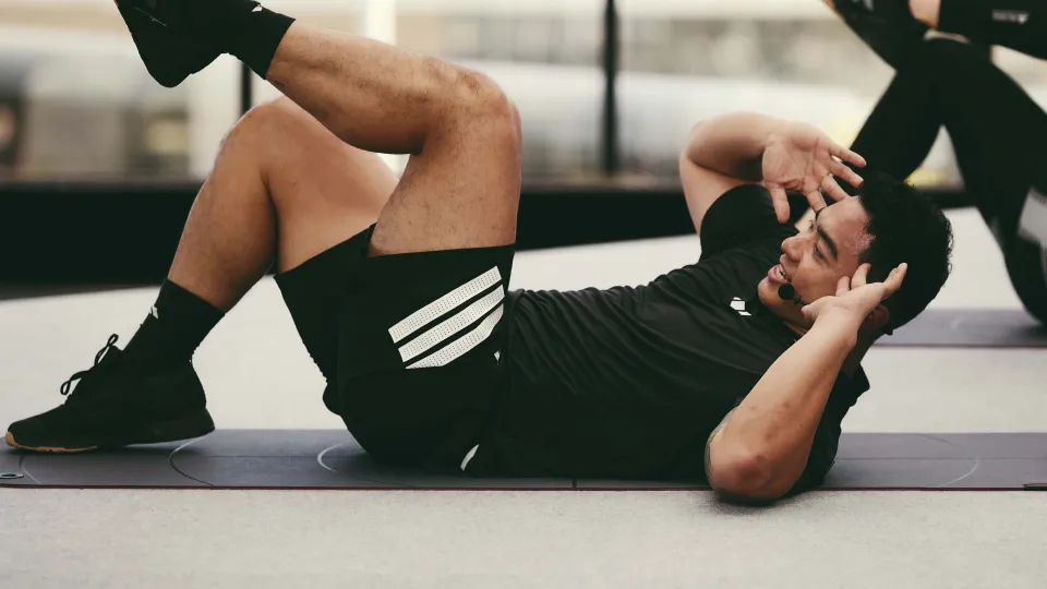 Les Mills Instructor performing core exercise