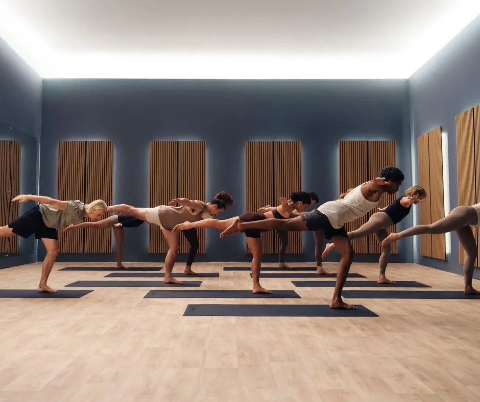 people take part in a serene group yoga class